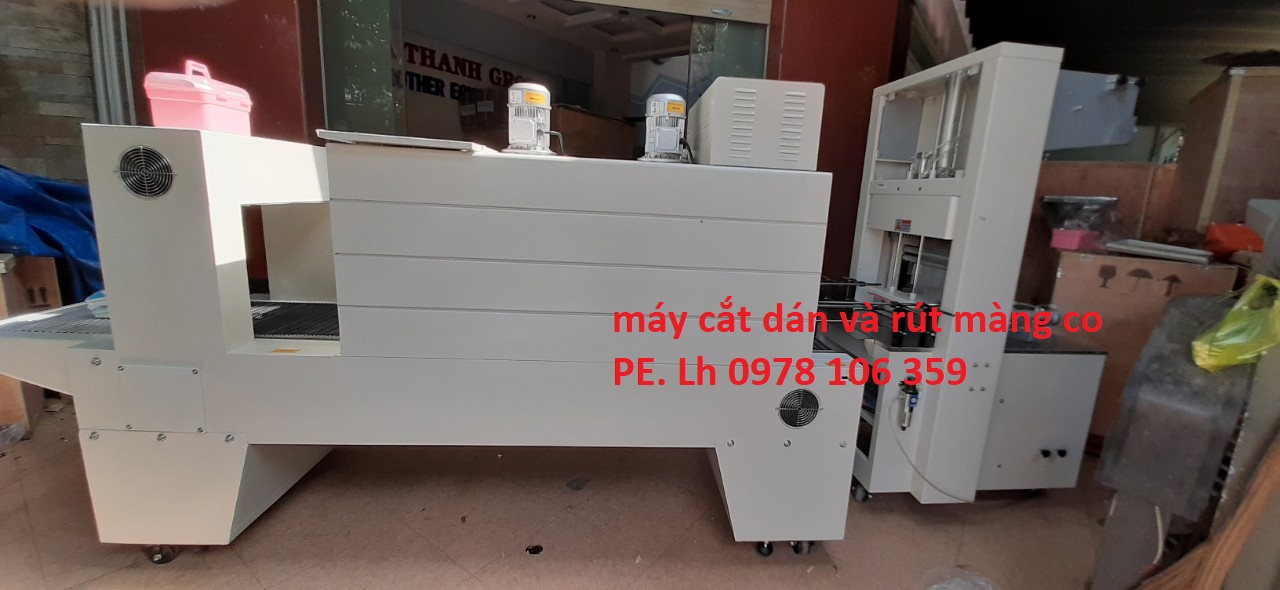 Máy cắt dán và rút màng co lốc chai- lon bán tự động, máy màng co lốc