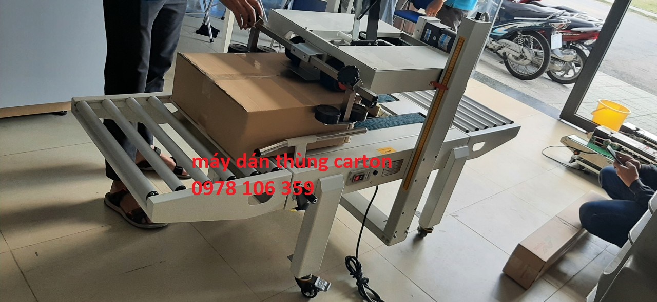 Máy dán băng keo thùng, máy dán thùng mặt trên mặt dưới bán tự động