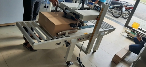 Máy dán thùng carton, máy dán băng keo thùng, máy dán thùng mặt trên mặt dưới FXA6050