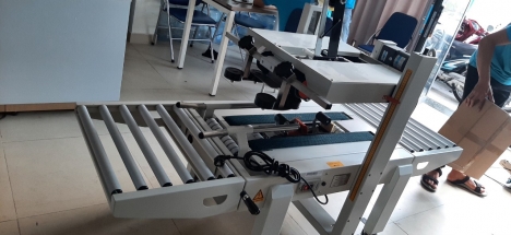 Máy dán thùng, máy dán băng keo thùng, máy dán thùng mặt trên mặt dưới FXA6050